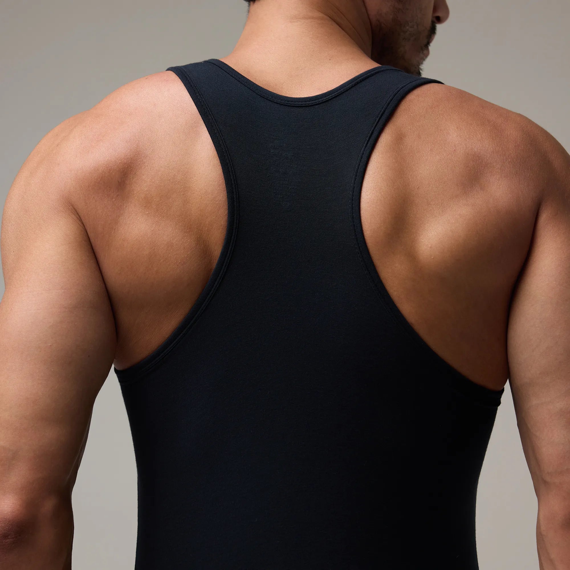 Black T1X Trunk-Cut Bodysuit for Men – Stretchable, Comfortable Innerwear by Soma. Carbon